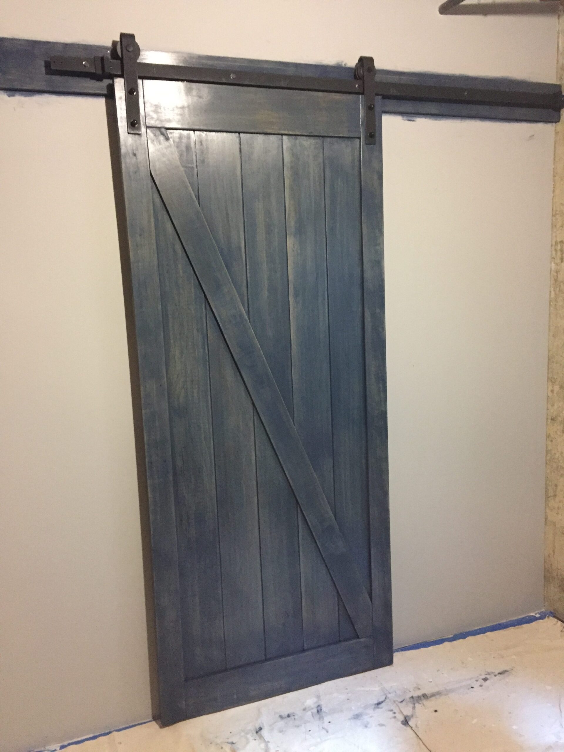 A blue wooden sliding door