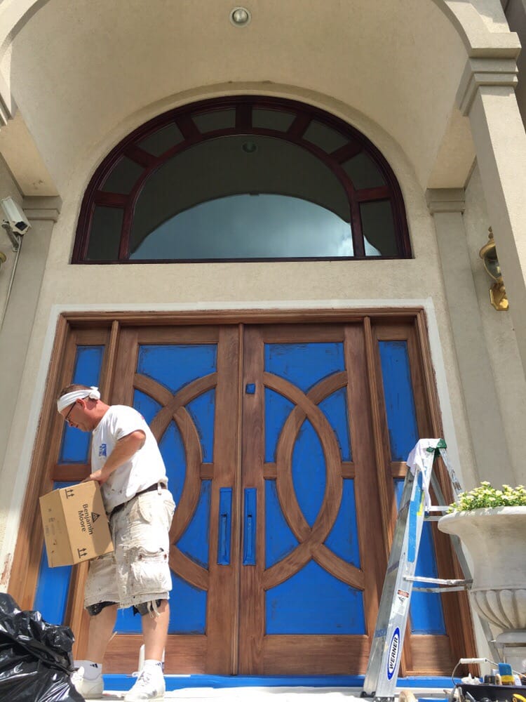 Painter preparing to paint the front entrance