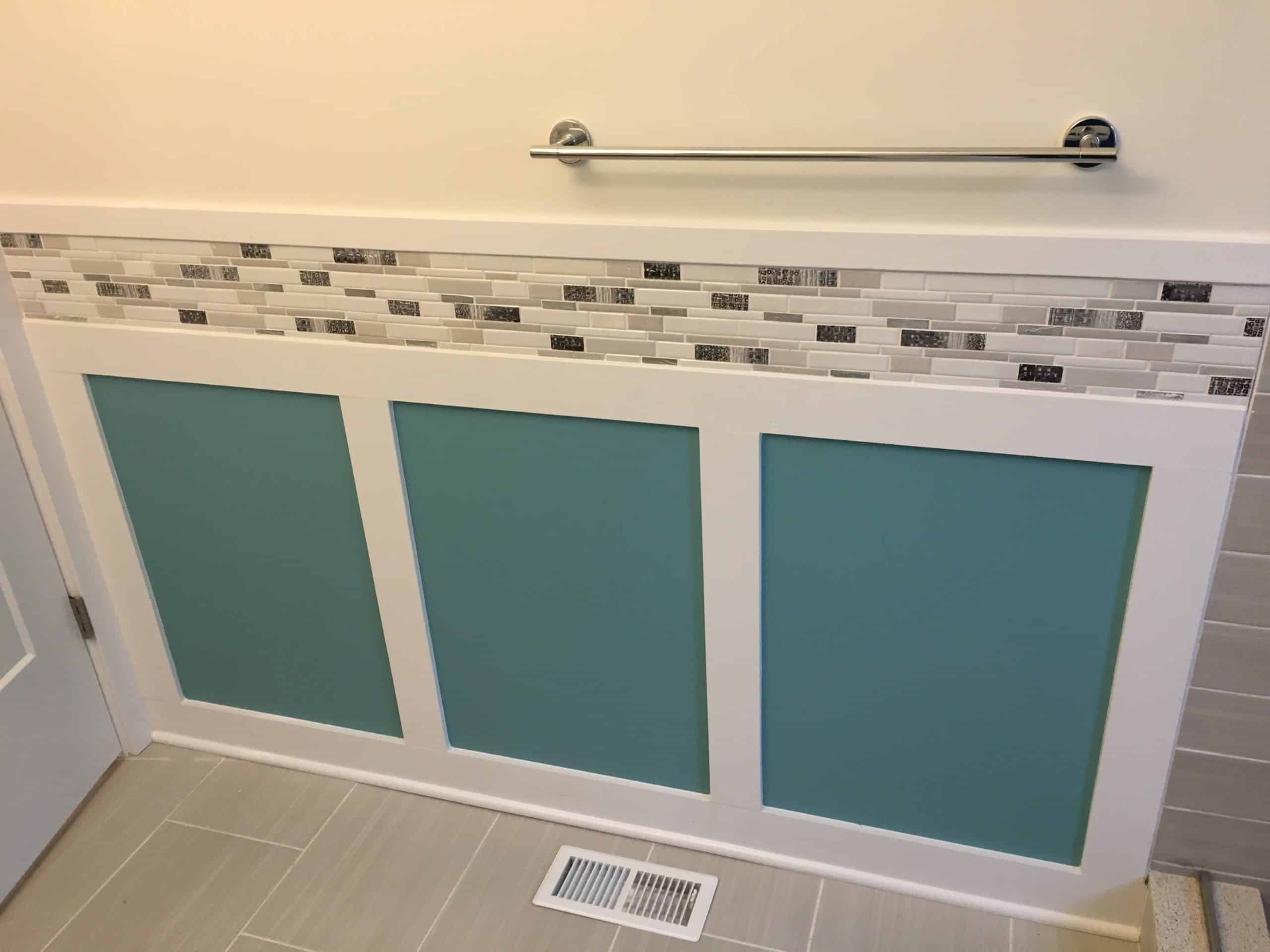 Bathroom wall with three small turquoise wall