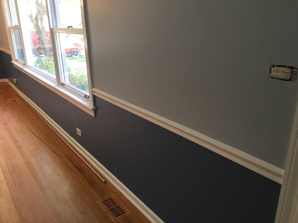 Painted wall that is half light blue and dark blue