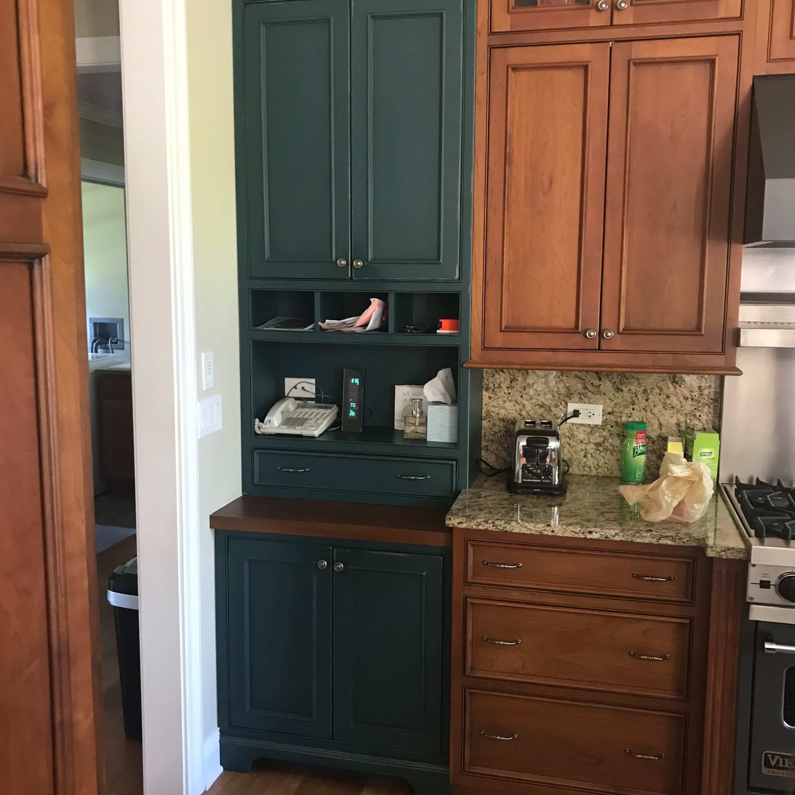 Small corner green cabinet in the kitchen
