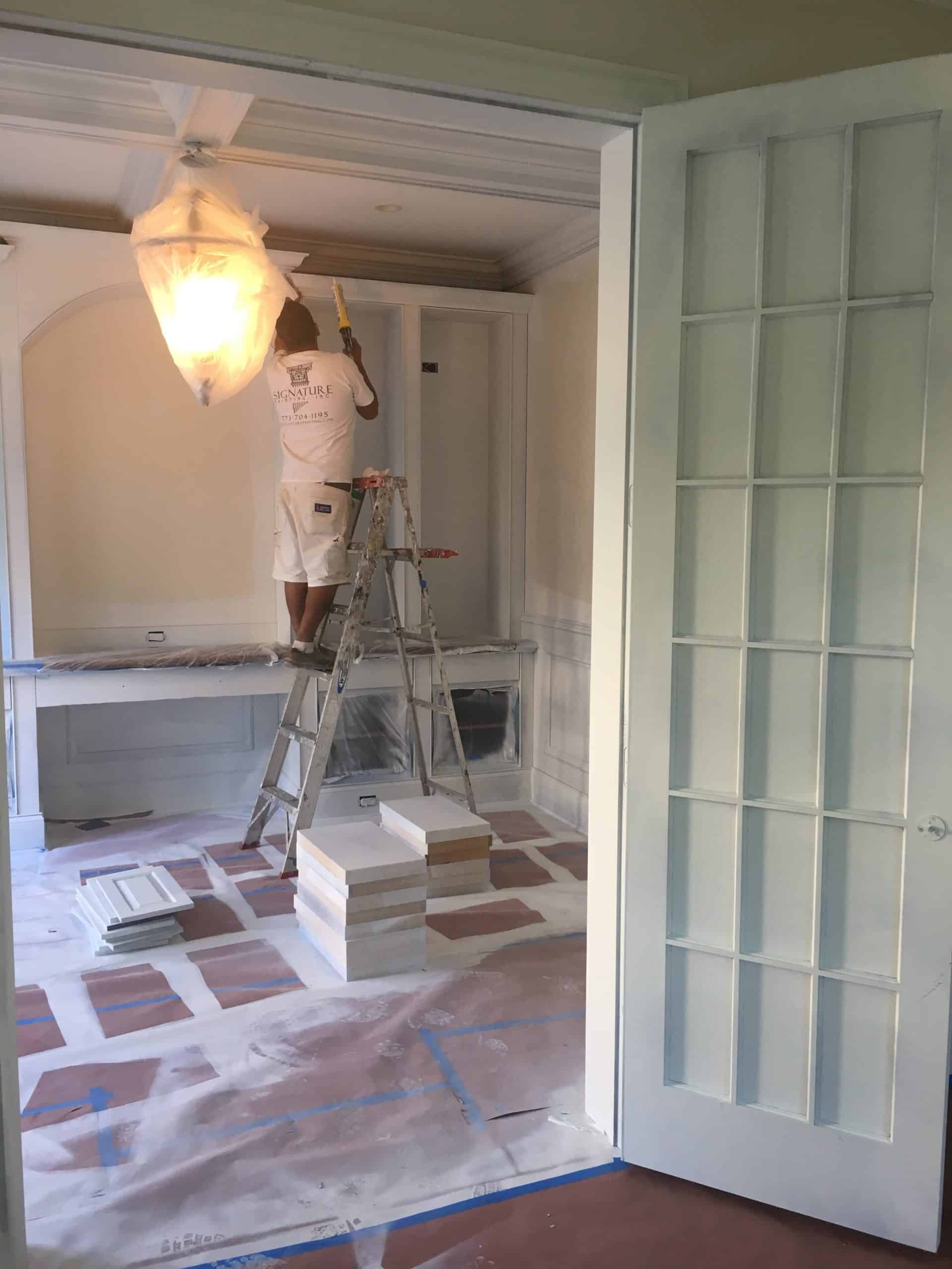 A covered room being painted